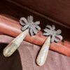 #77 The new retro long pearl bow diamond-encrusted earrings from Europe and America feature a noble, elegant and fashionable style. The ribbon earrings are exaggerated and personalized