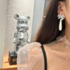 #77 The new retro long pearl bow diamond-encrusted earrings from Europe and America feature a noble, elegant and fashionable style. The ribbon earrings are exaggerated and personalized - Image 3