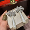 #77 The new retro long pearl bow diamond-encrusted earrings from Europe and America feature a noble, elegant and fashionable style. The ribbon earrings are exaggerated and personalized - Image 4