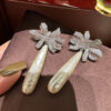 #77 The new retro long pearl bow diamond-encrusted earrings from Europe and America feature a noble, elegant and fashionable style. The ribbon earrings are exaggerated and personalized - Image 6