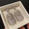#64 S925 Silver needle temperament mysterious pattern personality ancient Egyptian wind pharaoh mummy earrings European and American heavy industry zircon earrings
