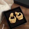 Vintage gold CC earrings, bracelet set - Image 4