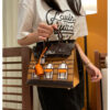 #164 A classic handbag with a color-blocked house bag - Image 2