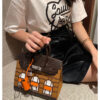 #164 A classic handbag with a color-blocked house bag - Image 3