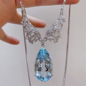 #209 Natural Santa Maria Aquamarine Necklace features a 38.98-carat 18k gold main stone set with diamonds
