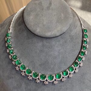 #214 Natural Sugar Tower Emerald Necklace features a 35.03-carat 18k gold main stone set with diamonds