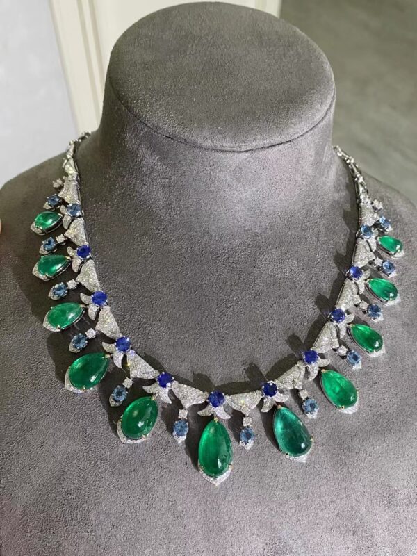 #210 Natural Emerald Necklace features a 41.09-carat 18k gold main stone set with diamonds and an international certificate
